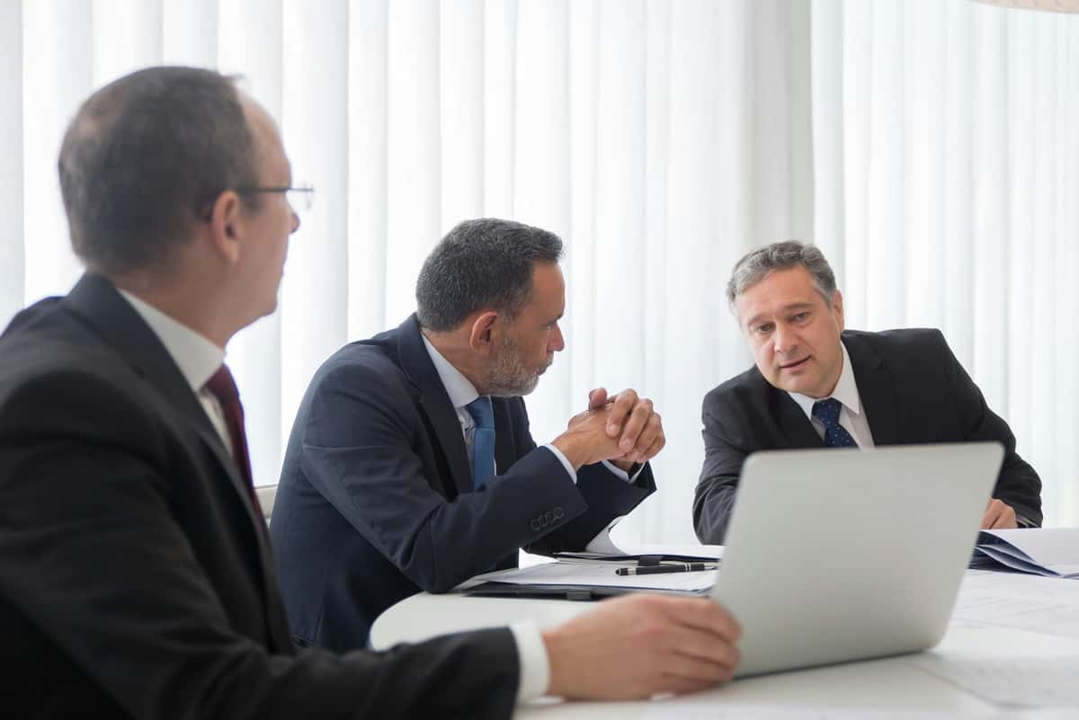 Board meeting discussing AI governance and compliance frameworks