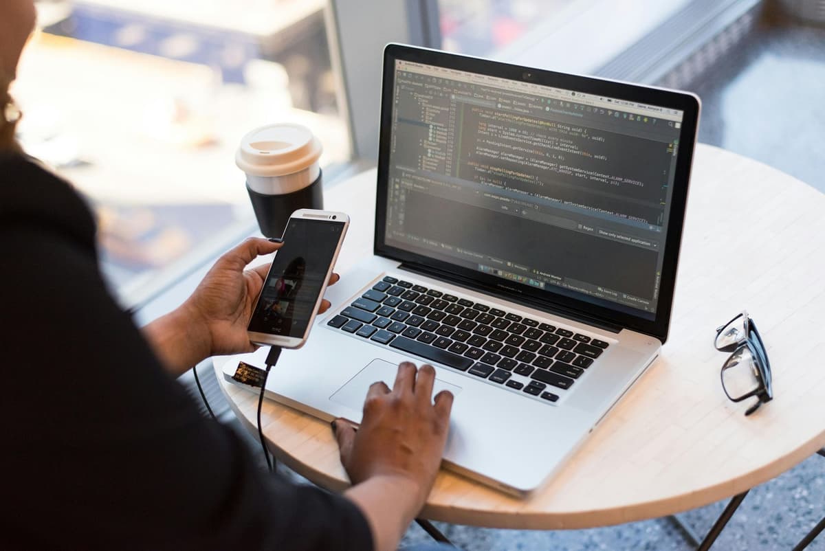 Remote work setup with laptop and mobile representing flexible IT workforce strategies
